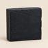 Black soap bar on a white background