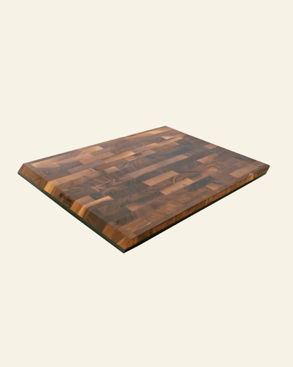 Wooden cutting board with a checkered pattern on a white background