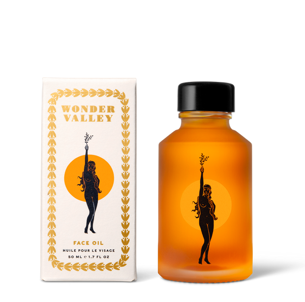 Orange bottle and box with 'Wonder Valley' branding on a white background