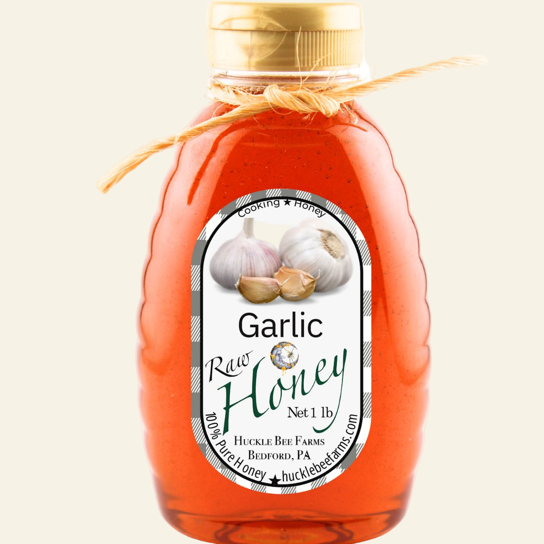 Bottle of Garlic Raw Honey with a label on a white background