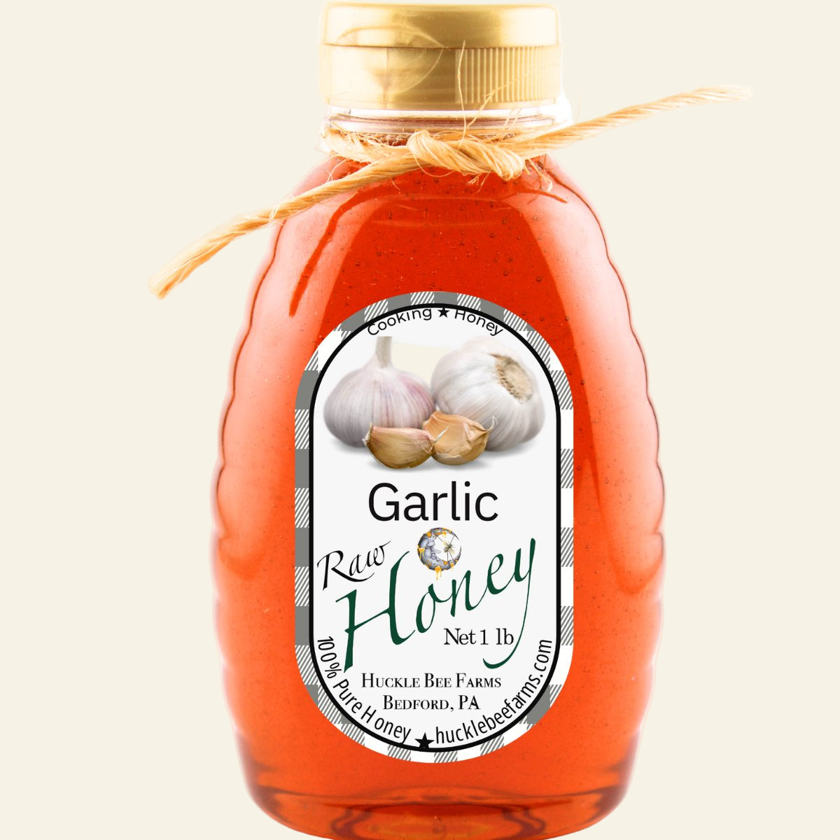 Bottle of Garlic Raw Honey with a label on a white background