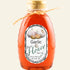 Bottle of Garlic Raw Honey with a label on a white background