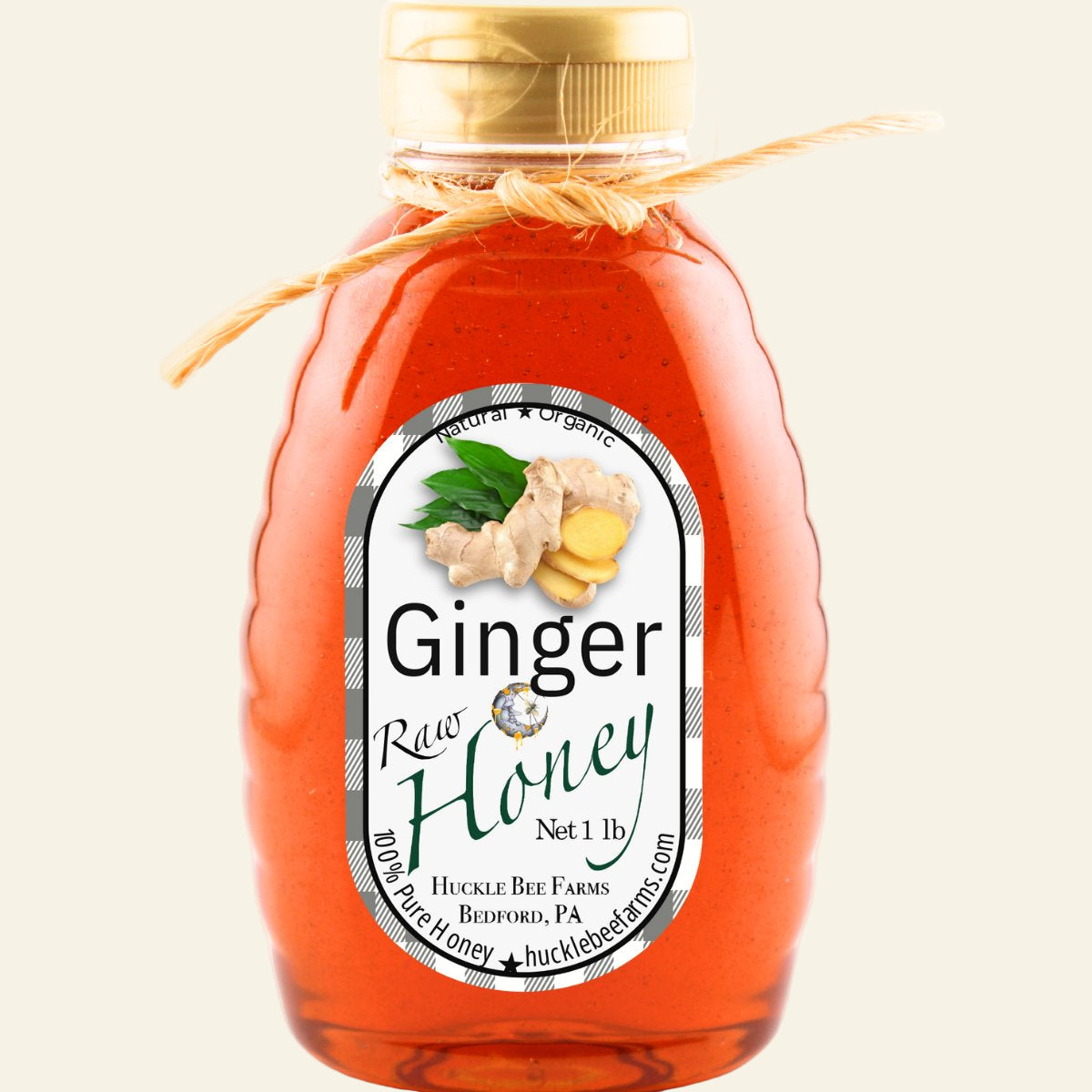 Bottle of ginger honey with a label on a white background