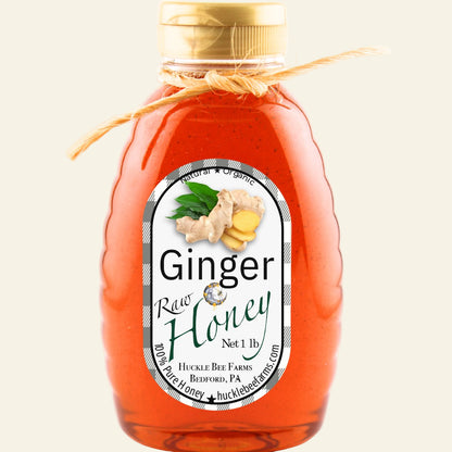 Bottle of ginger honey with a label on a white background