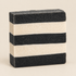 Bar of soap with black and white stripes on a white background