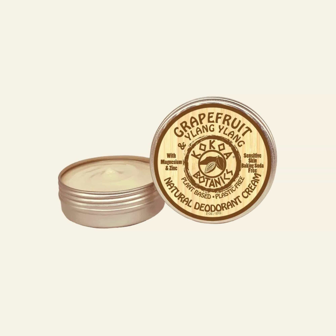 Grapefruit &amp; Ylang Ylang natural deodorant cream in a metal container with a wooden lid on a white background.