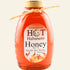 Bottle of Hucklebee Farms Hot Habanero Honey on a white background