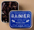 Tin of Rainier incense cones with a blue label featuring text and illustrations.