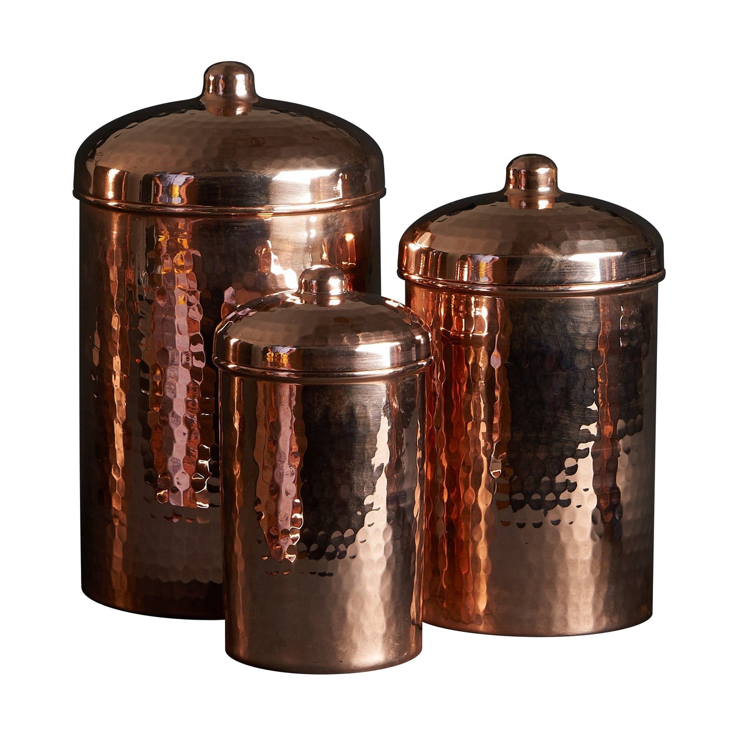 Set of three copper canisters with lids on a white background