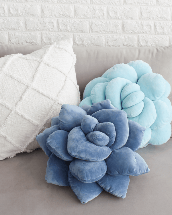 Blue succulent-shaped pillow on a transparent background