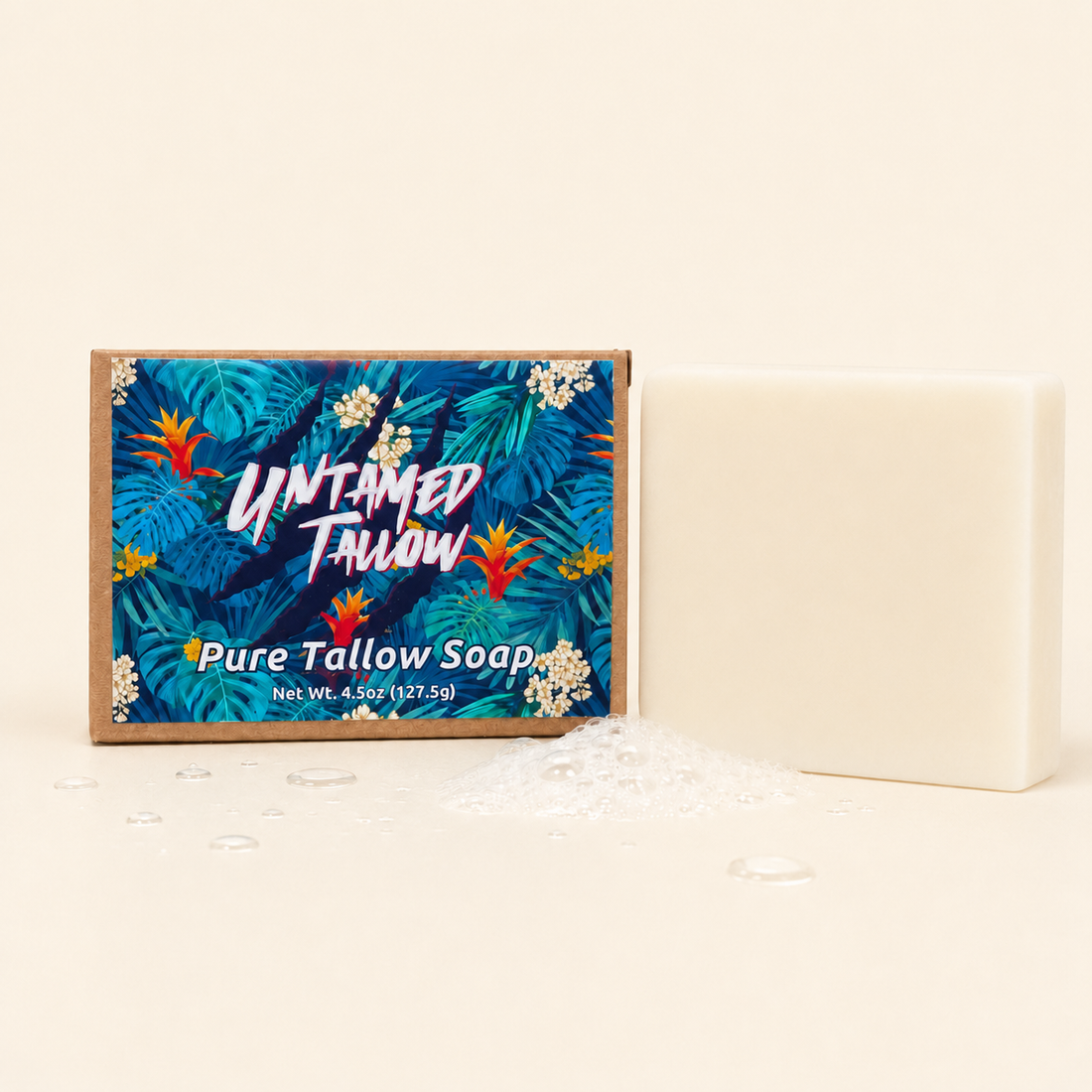 A bar of Untitled Tallow Pure Tallow Soap shown next to its tropical leaf-patterned packaging box on a warm cream background.