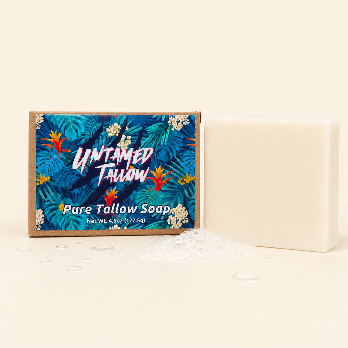 A bar of Untitled Tallow Pure Tallow Soap shown next to its tropical leaf-patterned packaging box on a warm cream background.