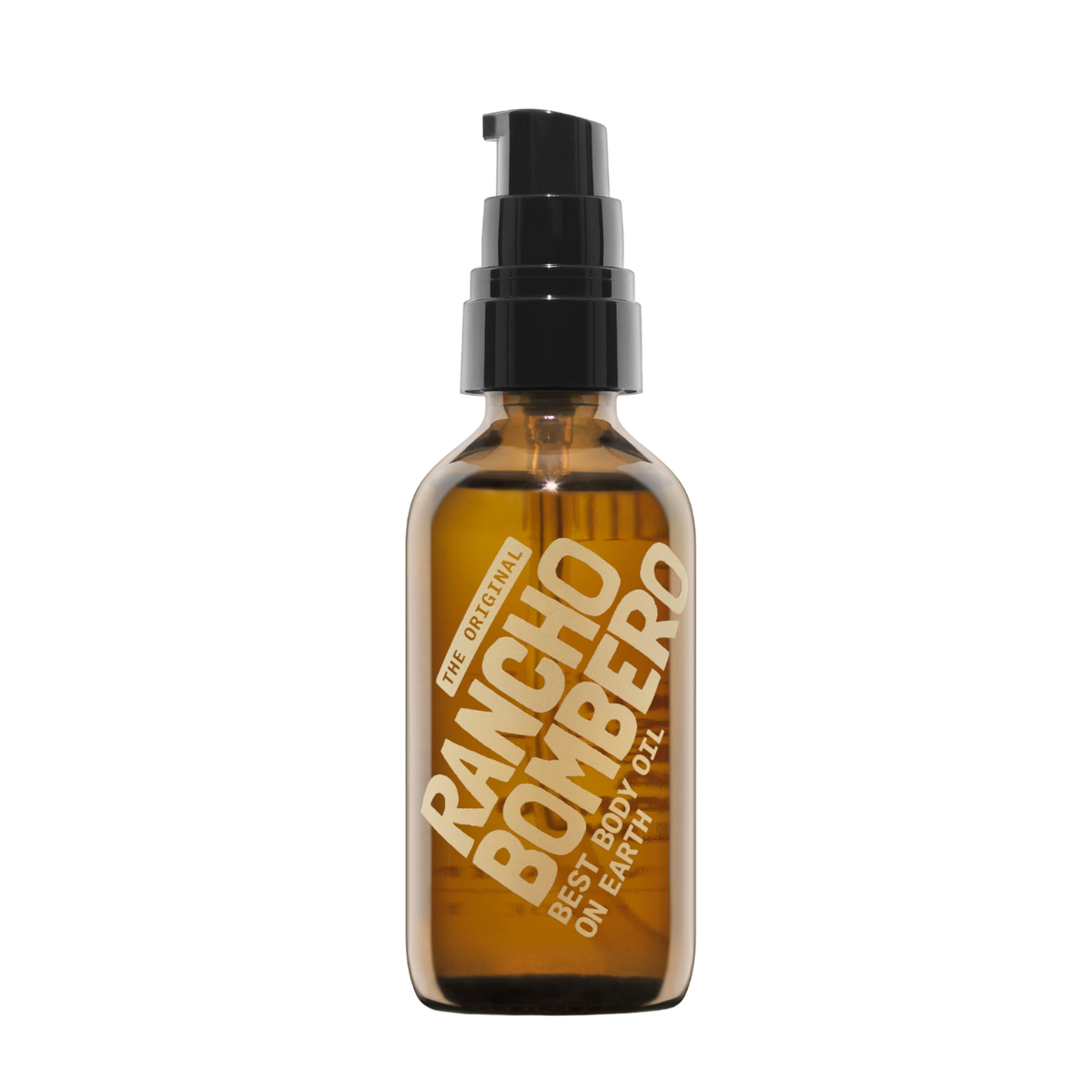 An amber glass pump bottle of Rancho Bombero Best Body Oil with a black pump dispenser and gold lettering, isolated on a white background.