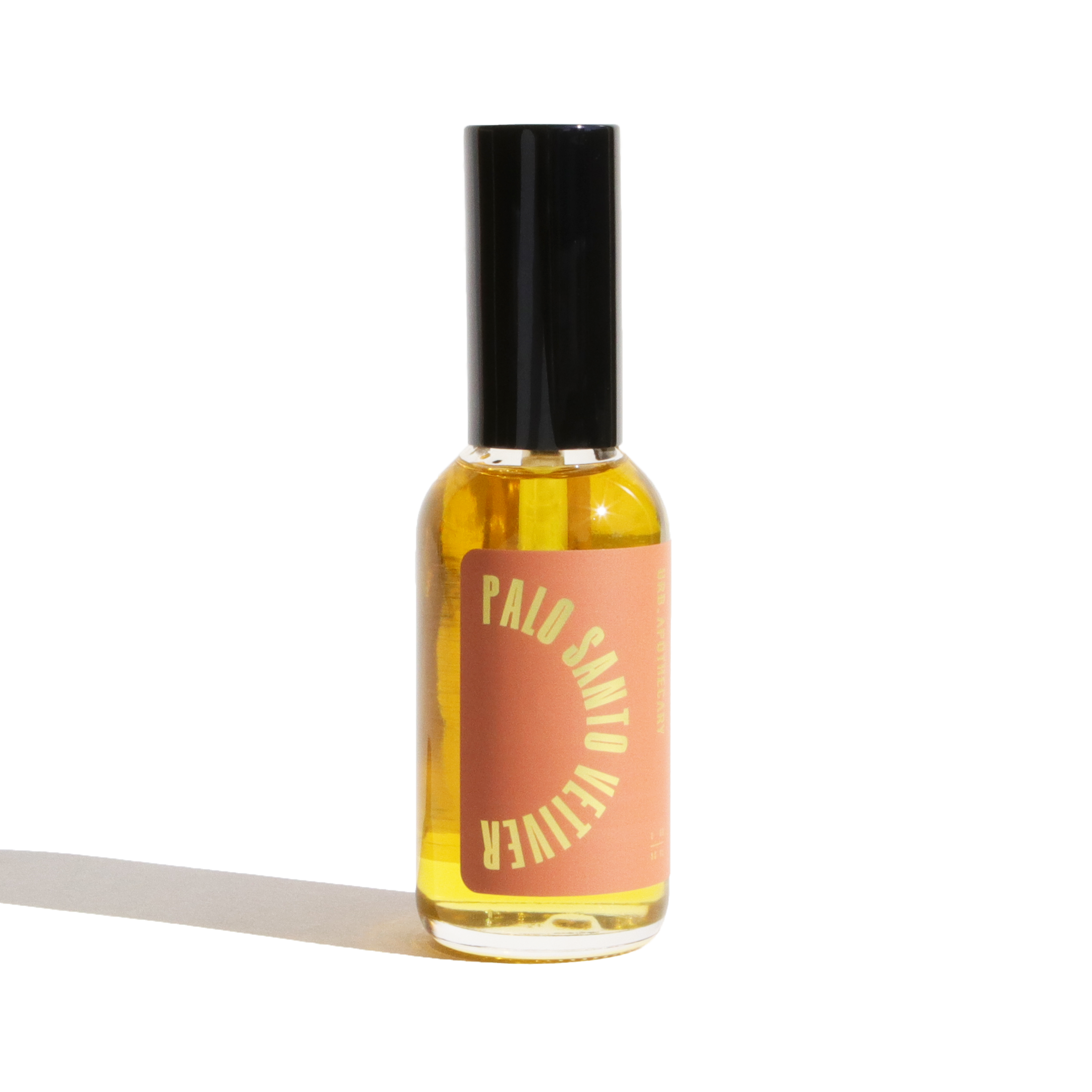Bottle of Palo Santo oil with a black cap on a white background