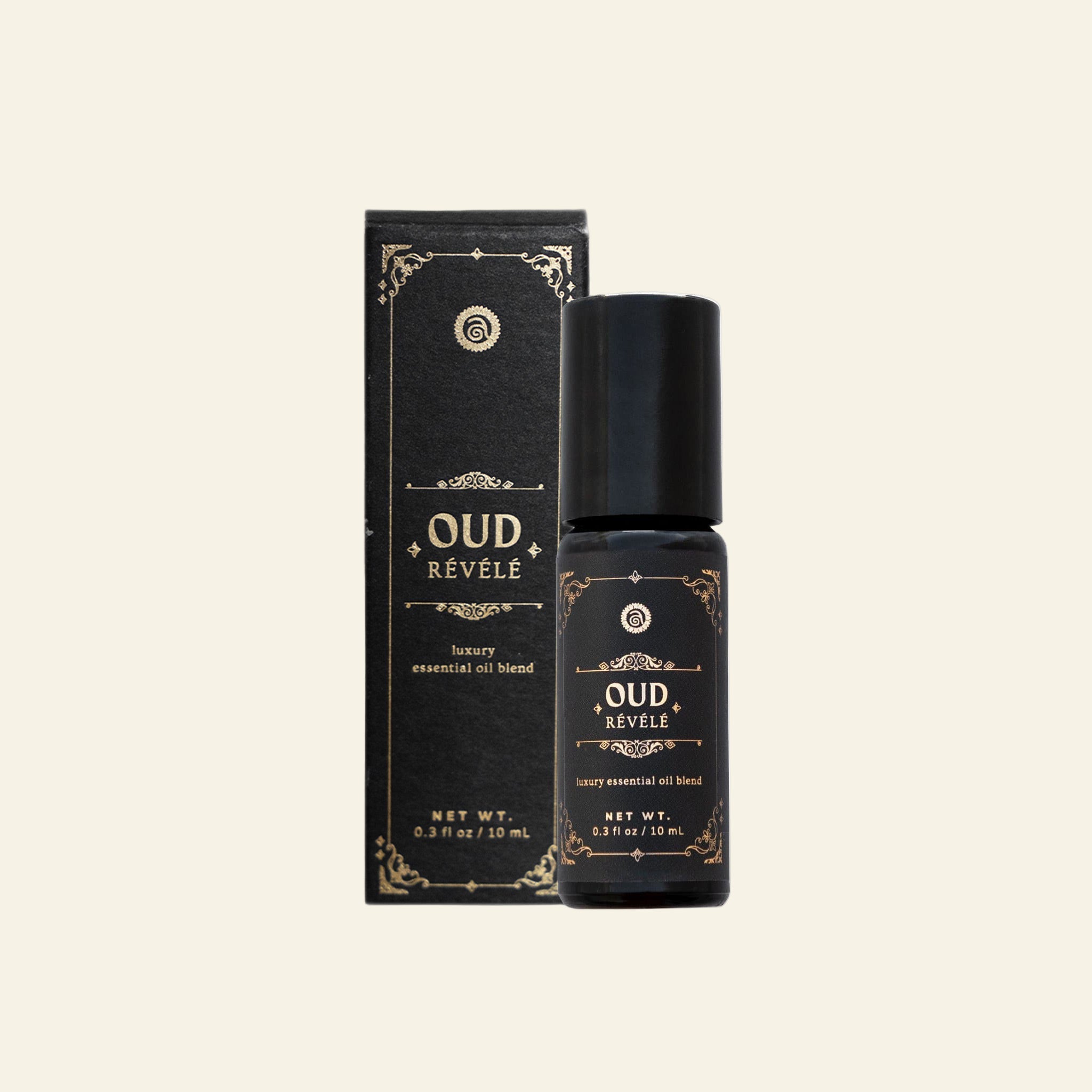 Oud Revele essential oil bottle and packaging on a white background