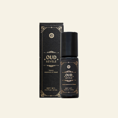 Oud Revele essential oil bottle and packaging on a white background