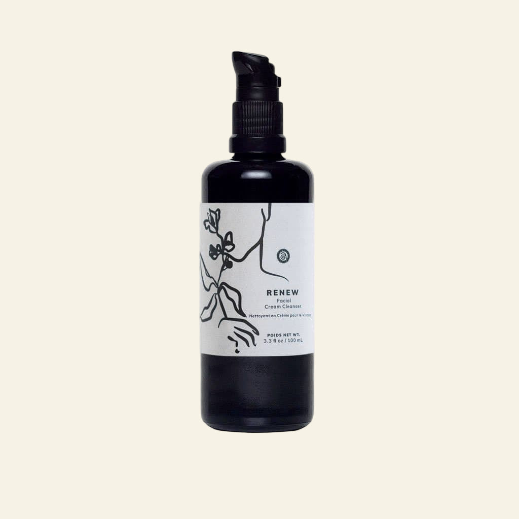 Black bottle with a white label on a white background