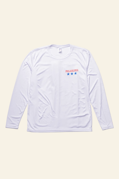 A white long-sleeve athletic shirt with a small chest graphic featuring the text &