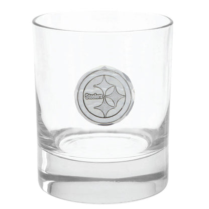 Clear glass with a metallic emblem on a white background