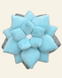 Blue succulent-shaped pillow on a beige background