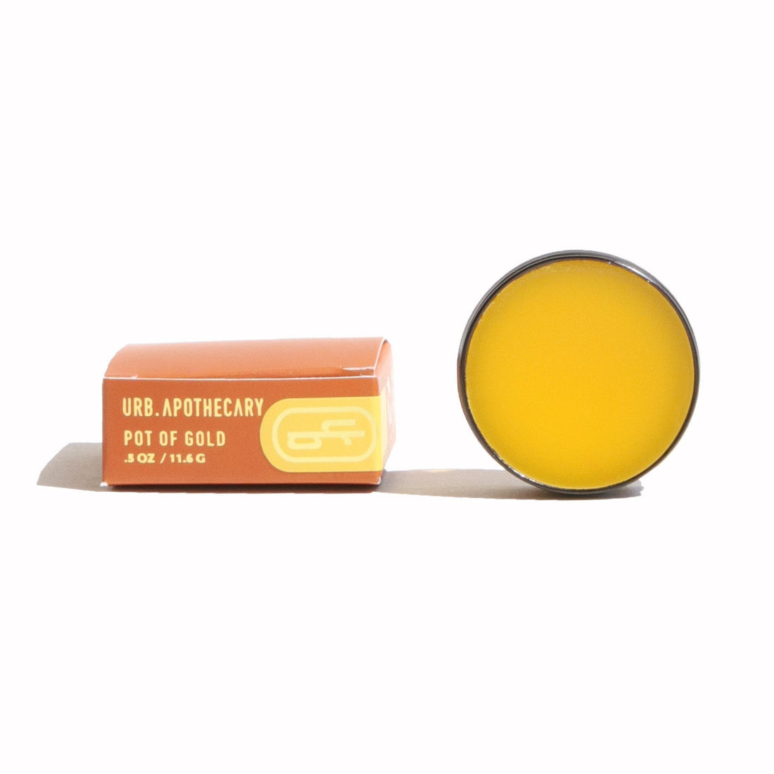 Yellow lip balm with a pink container on a white background