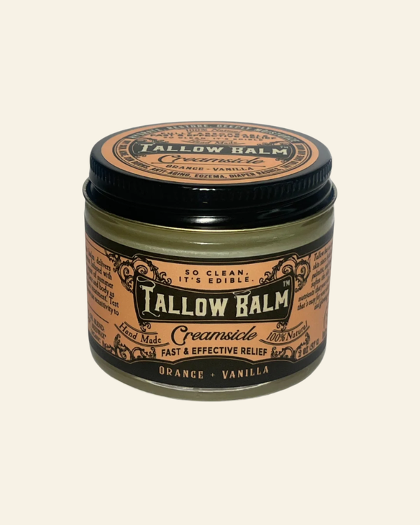Tallow Balm jar with black lid on a white background