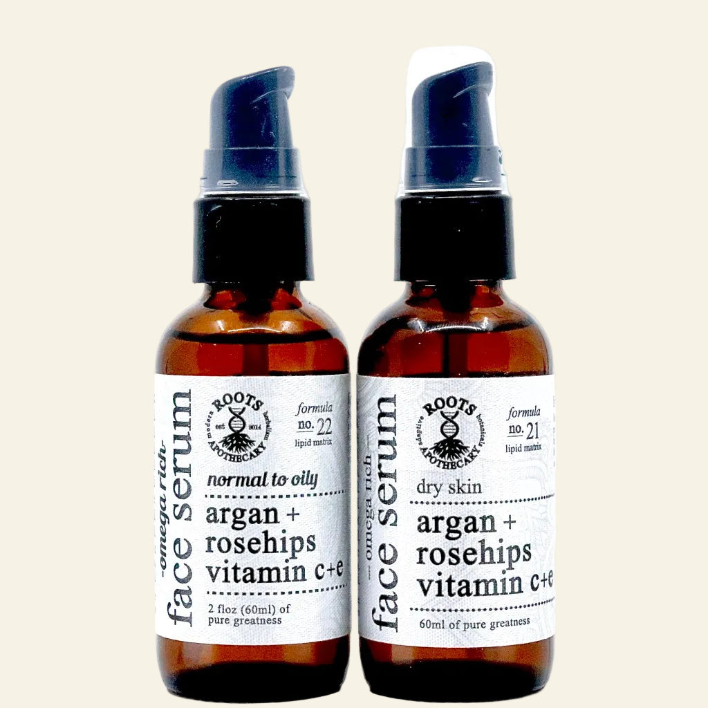 Two bottles of face serum with labels on a white background