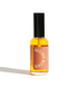 Small bottle of Roseline essential oil with a black cap on a white background