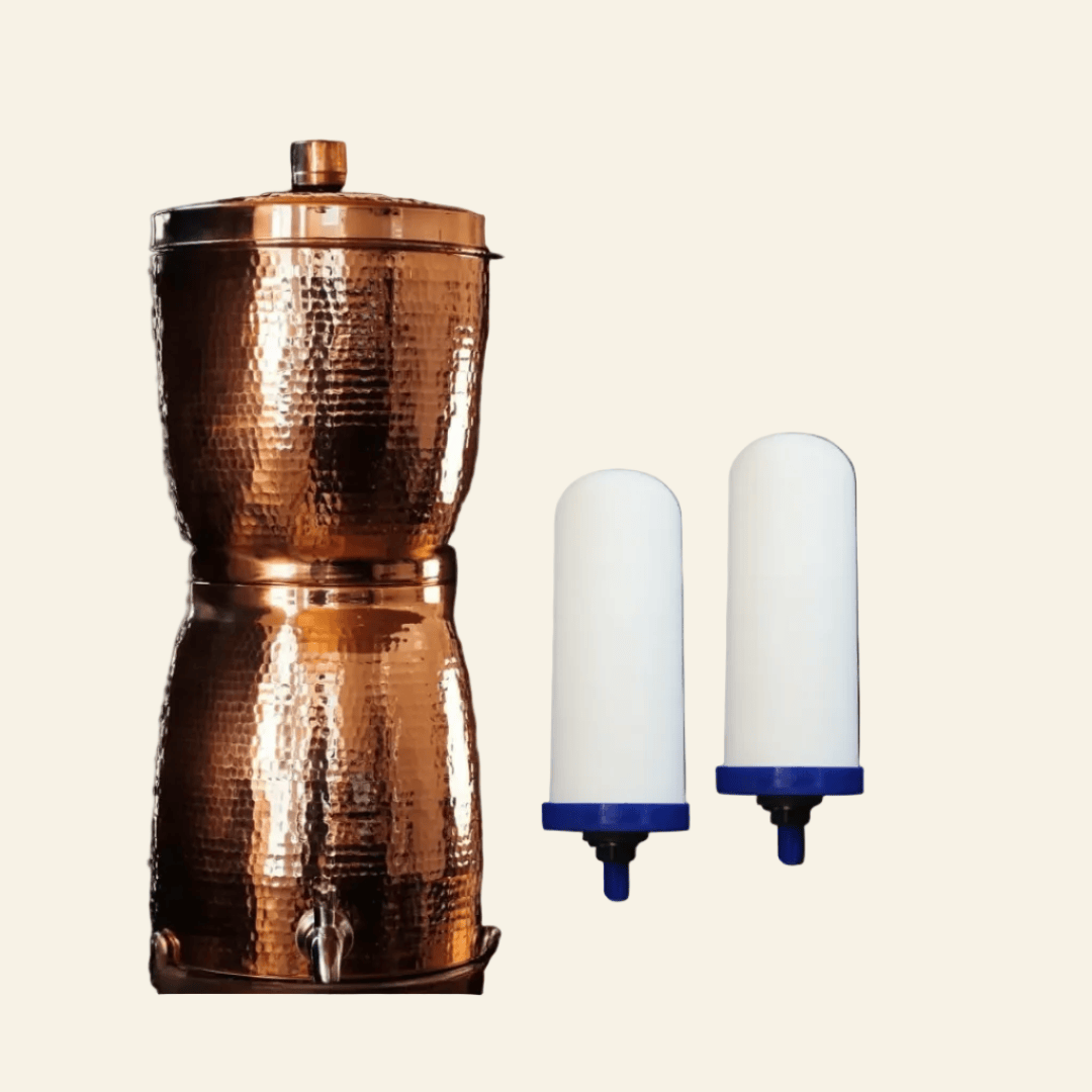 Copper filtration system with two ceramic candles on a beige background, labeled &