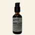 Bottle of Shilajit with Roots Apothecary label on a white background