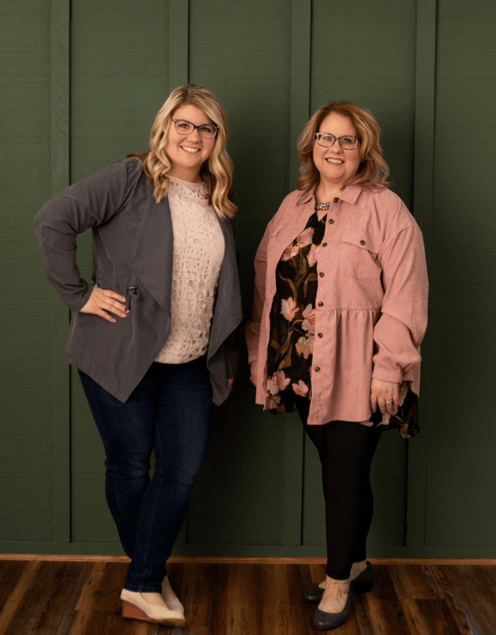Founders of simply stated standing against a green wall