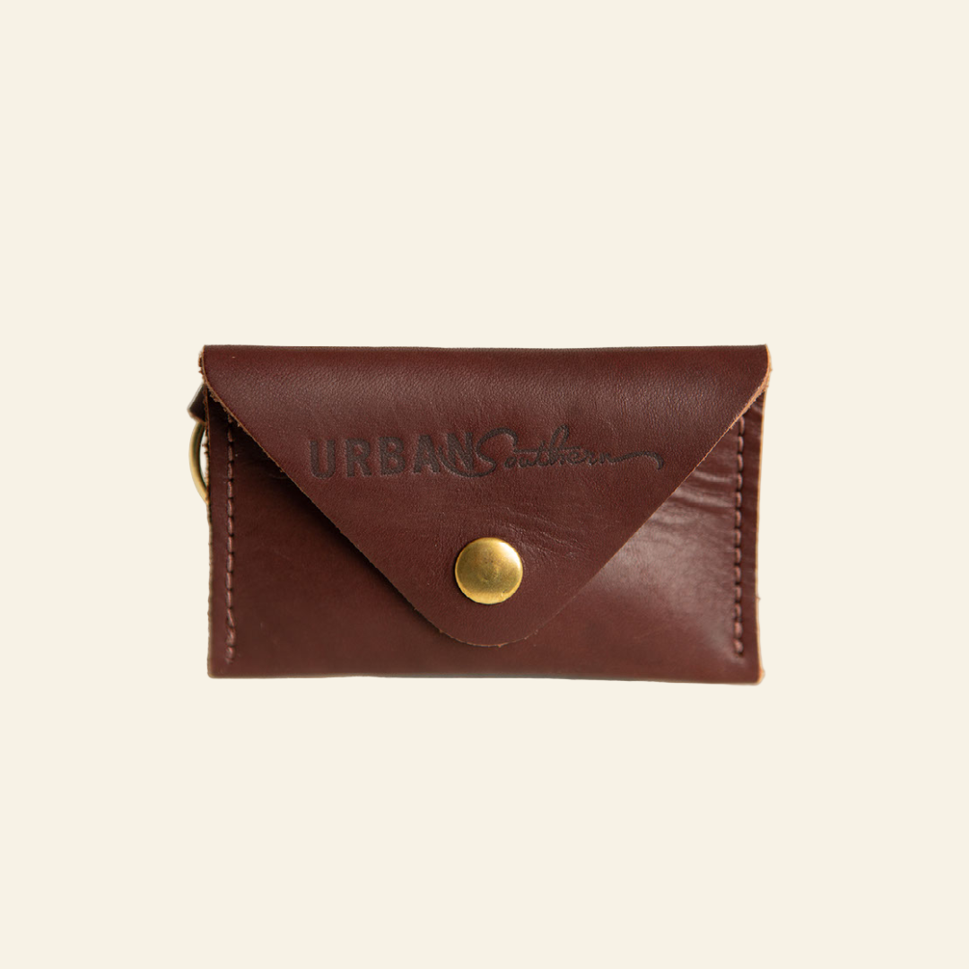 Brown leather wallet with gold button and &