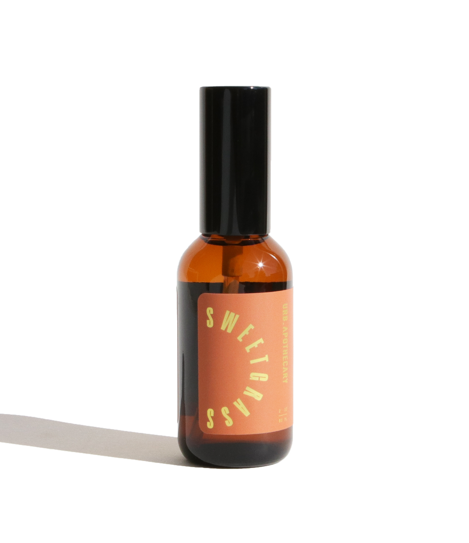 Small brown bottle with a black cap on a white background