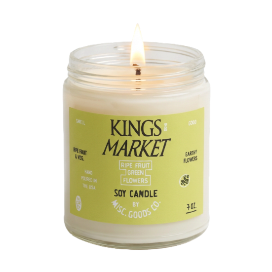 Soy candle in a glass jar with a label on a white background