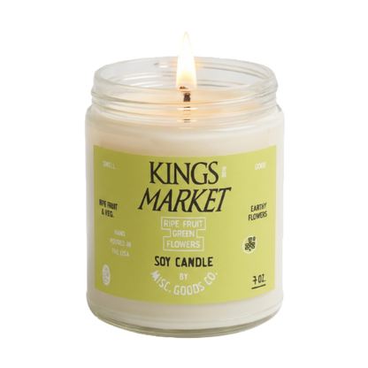 Soy candle in a glass jar with a label on a white background