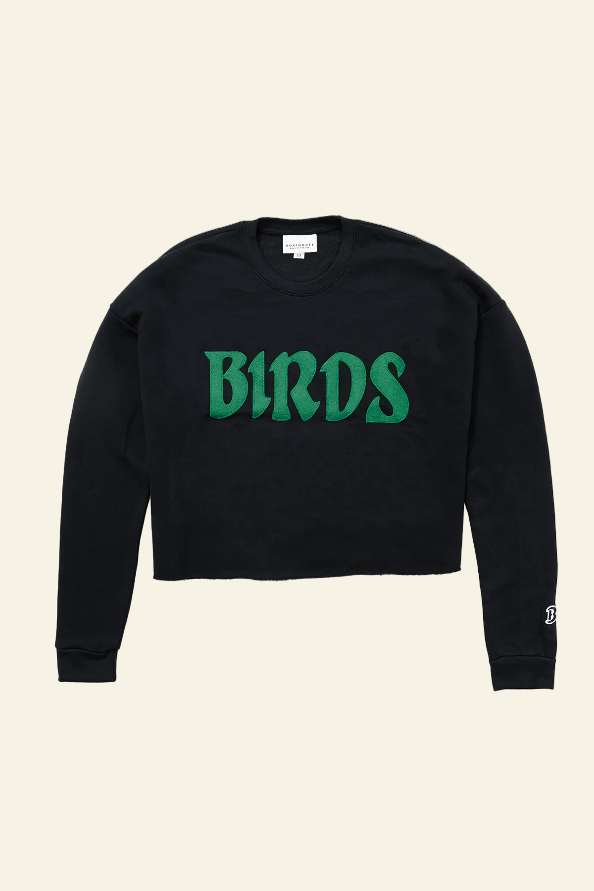 A black long-sleeve cropped sweatshirt featuring the word &