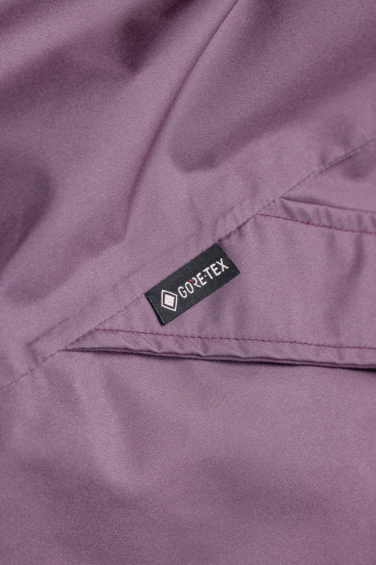 Gore-Tex label on a purple fabric surface